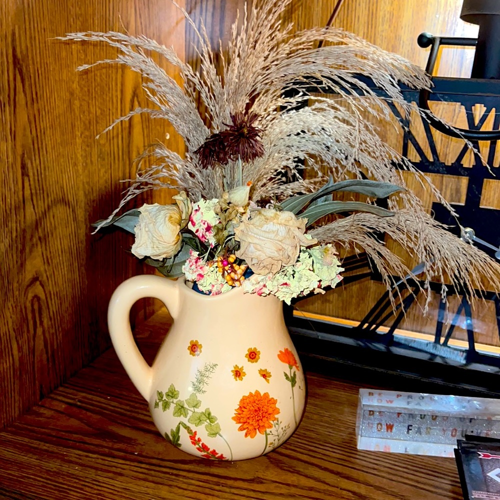 Water basin dried floral arrangement